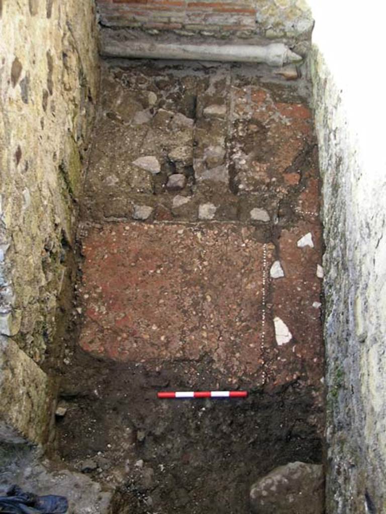 VI.25, Herculaneum. May 2004. Looking north in rear room.
The doorway to the front shop-room is on the lower left. Photo courtesy of Nicolas Monteix.